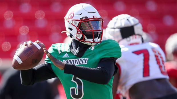 Malik Cunningham throws during practice at Cardinal Stadium on Sunday, April 3, 2021.